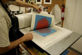 artist pulling a monotype